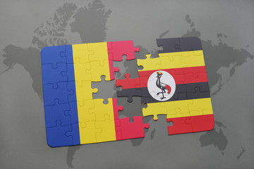 puzzle with the national flag of romania and uganda on a world map