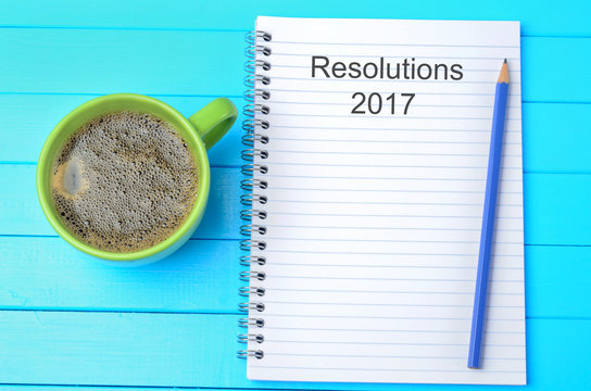 Resolutions 2017 year written on notebook