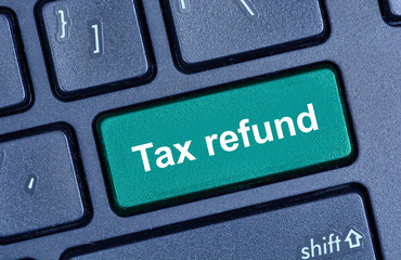 Tax refund words on computer keyboard