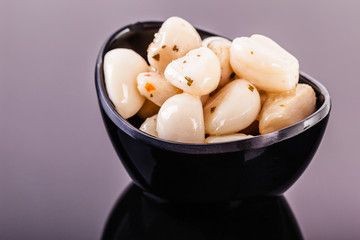 Garlic cloves on black
