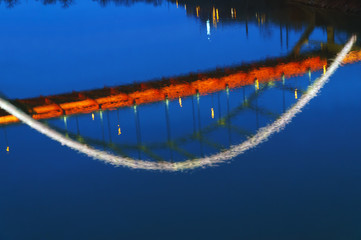 Bridge reflection on the river surface. 