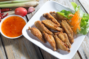 Chicken wings, fried foods (Thailand).