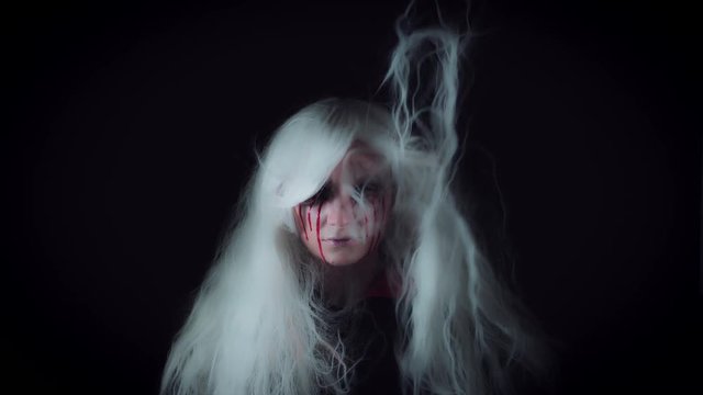 4K Horror Witch with Bloody Tears and Wind in White Hairs