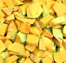 Orange long pumpkin cut into pieces
