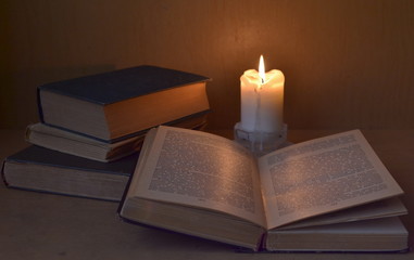 evening, candle and old books