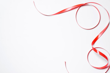 Festive red ribbon isolated on white background