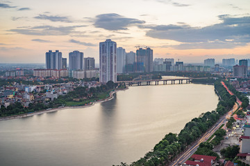 Fototapeta na wymiar Aerial view of Hanoi cityscape at twilight. Linh Dam lake