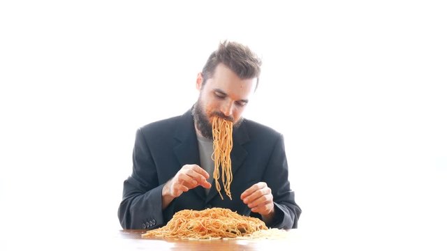 Disgusting Businessman Eating Pasta On The Table. Overeating And Crazy Nasty Consumerism Concept, Studio Isolated On White Background.