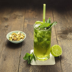 Mojito cocktail with mint leaves and lime