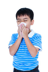 Handsome asian boy blowing his nose into tissueon. Isolated on white background.