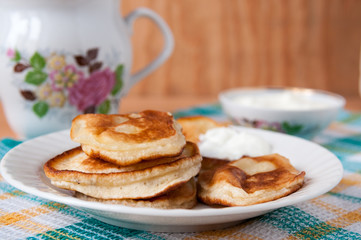 Delicious pancakes with sour cream for breakfast