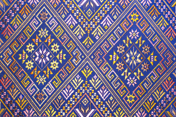  old colorful thai handcraft peruvian style rug surface old vintage torn conservation Made from natural materials Chemical free close up.