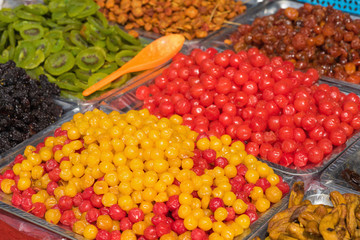 Colorful dried salted or sugared Asian tropical fruits