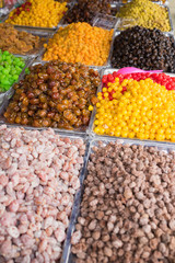 Colorful dried salted or sugared Asian tropical fruits