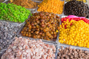 Colorful dried salted or sugared Asian tropical fruits
