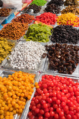 Colorful dried salted or sugared Asian tropical fruits