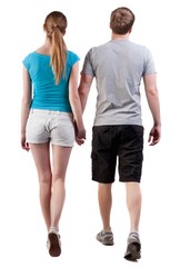  Back view of going young couple (man and woman)