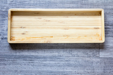 Top view of empty wooden square tray background