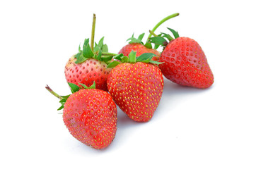 Collection of strawberry fruits of different shaped.