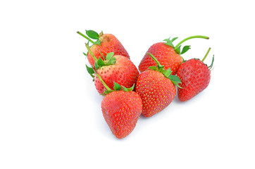 Collection of strawberry fruits of different shaped arranged in