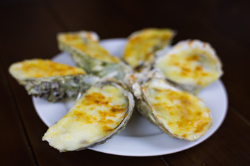 Cheese grilled oyster on dish