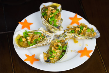 Barbecue geoduck with onion and grease. Asian food