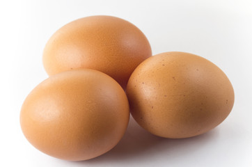 Three eggs on a white background