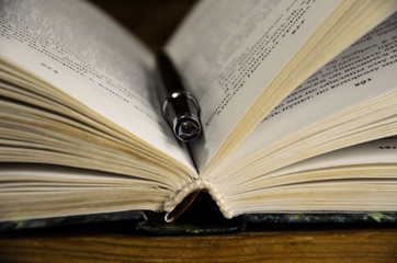 Open book and fountain pen