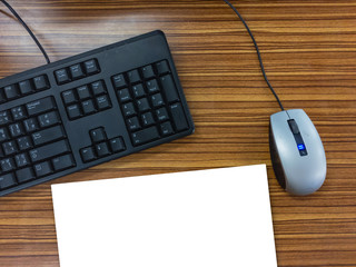 keyboard  mouse empty paper on wooden background. Work space.