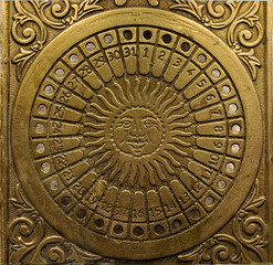 Brass vintage sundial with a calendar 1
