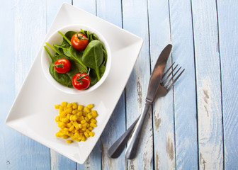 spinach tomato salad food fresh healthy cook rustic wooden background
