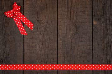 Fototapeta premium Decorative ribbon on the old wooden table.