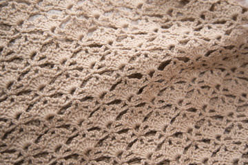 Brown sweater knitted in manual photographed in close-up.
