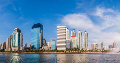 Fototapeta na wymiar panorama modern building under the blue sky and cloudy with refl