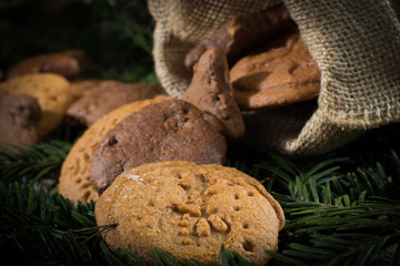 Christmas cookies on a black background with Christmas tree