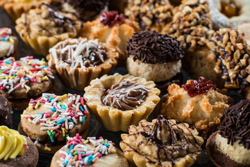 Cookie with marmalade and chockolad on a black background