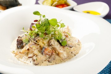steak cream pasta on table