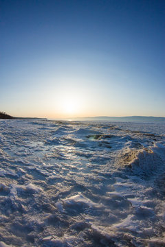 snow sunrise wave on the shore of Olkhon. Baikal