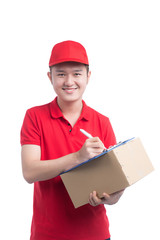 Handsome young worker in red t-shirt and cap smiling, holding a