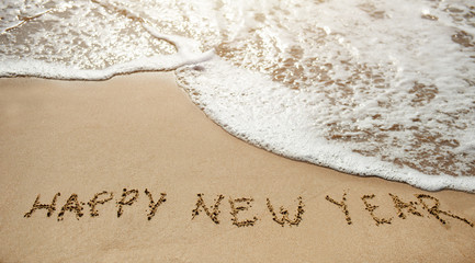 Happy new year on the sand beach