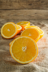 Oranges Fruits and Orange Slice on Wooden Table and Retro Fabric