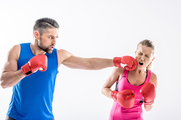 Fototapeta na wymiar Man and woman boxing