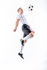 Fototapeta premium Soccer player exercising with ball