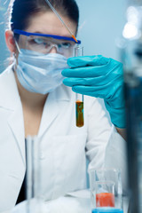 Young researcher handling chemical agents