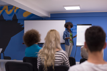 Naklejka na ściany i meble Black woman Speaker Seminar Corporate Business Meeting Concept