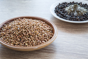 Buckwheat on the wooden board. Healthy eating and lifestyle.