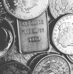 Silver coins and bars background