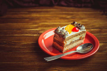 Appetizing cake on a wooden table.
