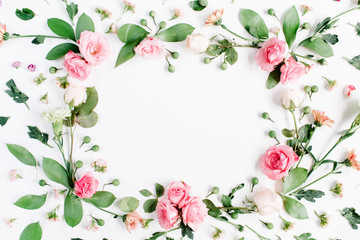Round frame made of pink and beige roses, green leaves, branches, floral pattern on white...