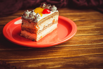 Appetizing cake on a wooden table.